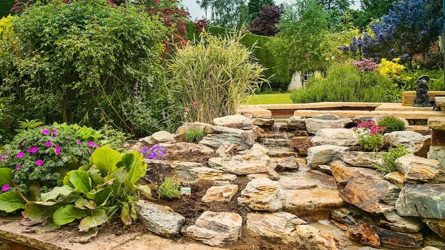 Beautiful Cascading Flowers Pouring Over the Side of a Garden Wall image 3